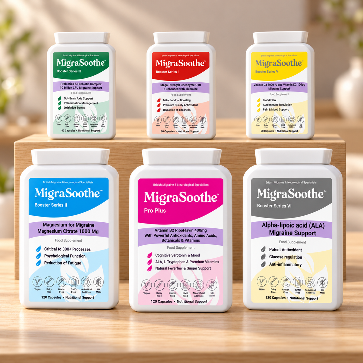 Ultimate pack on pale oak: large Pro, Magnesium and Alpha-lipoic acid bottles in front, with smaller Probiotic, CoQ10 and Vitamin D3/K2 bottles behind.